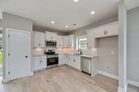 The Kitchen features a Pantry for plenty of storage!