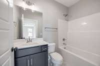 The Guest Bathroom features a combination Tub/Shower