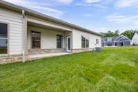 The Covered Rear Porch offers a safe haven for morning coffee or afternoon barbeques!
