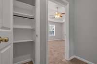 Landing area at the top of the staircase on the 2nd Level.  Notice the Linen closet to the left.  The door to the right leads you to the Primary Bedroom which is located at the front of the condo.