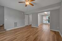 Living Room.  View looking toward the Kitchen which is the opening to the right.  The main entry hallway is to the left.