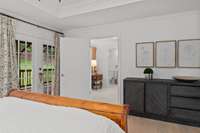 Primary bedroom adjacent to laundry room