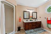Shared bath with stand up shower and double sinks