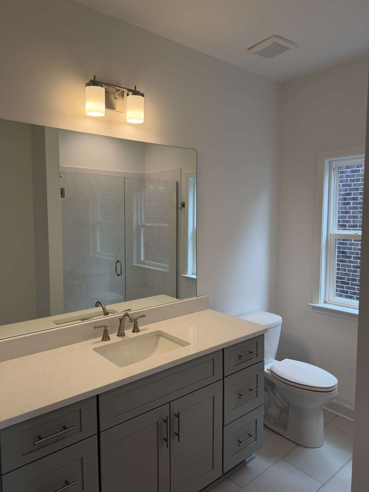 Full guest bathroom on main level with walk-in shower