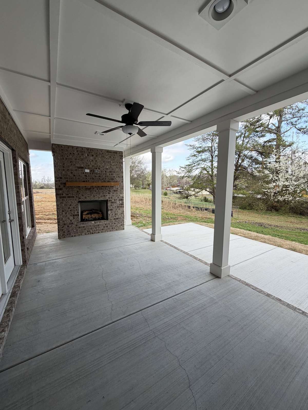 Large rear outdoor patio with gas fireplace and a gas hookup for your outdoor kitchen