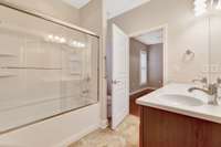 Guest bathroom with combo tub/shower.