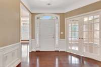 Coming in the front door, the kitchen is to the right and the office is the left.