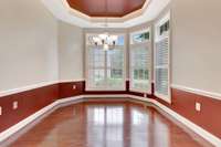 Nook in kitchen with tray ceiling.