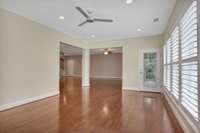 Florida room looking into the living to the left and back screen porch to the right.