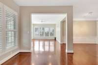 Plantation shutter throughout home. From the living room looking into the Florida room.