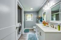 Hall Bath with Laundry and double vanitites