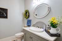 Half Bath with a custom built 48" vanity, quartz countertop.
