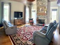 The Family Room is spacious enough to entertain comfortably and features a striking stone stacked fireplace, 17'3"X18.