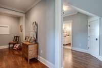 The hallway and landing at the top of the stairs are generously proportioned, creating an open space that provides easy access to adjoining rooms.