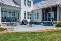 Just steps from the Kitchen and both Porches, a spacious, 14X17 concrete patio creates an inviting outdoor living area. Its durable surface is perfect for hosting gatherings, dining al fresco, or relaxing while enjoying views of the landscape.