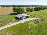 The property includes a well-constructed barn paired with a functional lean-to, offering versatile space for a variety of needs.