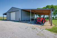 The lean-to provides additional covered space—ideal for storing equipment, firewood, or even creating a sheltered area for outdoor projects.