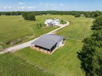 The barn features a classic design with ample room for storage, livestock, or workshop use, depending on your lifestyle.