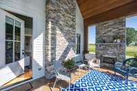The screened Porch is conveniently located just off the Family Room, featuring an accent wall and fireplace crafted from authentic stone.