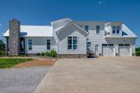 The driveway was designed to provide ample space, comfortably accommodating parking for up to 4 vehicles with ease. In addition, it includes a dedicated 220-volt outlet specifically for a camper or RV, making it ideal for travelers or guests.
