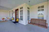 The Front Porch is generously sized to fit cozy seating arrangements including rocking chairs and a classic porch swing while offering a peaceful retreat.