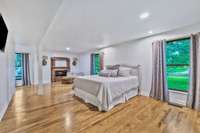 Expansive master suite with electric fireplace
