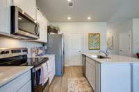 Photos of the staged model home, not of the listing.