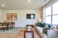 Photos of the staged model home, not of the listing.