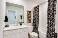 Photos of the staged model home, not of the listing.
