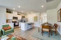 Photos of the staged model home, not of the listing.