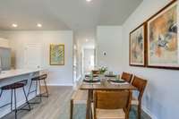 Photos of the staged model home, not of the listing.