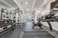 Home Gym with rubber floors and mirrored walls