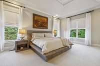 Primary Bed is tucked away in the back and overlooks the pool