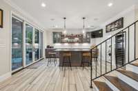 Perfect for entertaining, this Kitchen/Bar offers an ice maker, dishwasher, sink and wine fridge