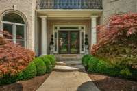 Walk up to the elegant double front doors