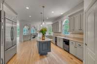 Features continue.. Stainless steel double ovens, SS refrigerator, pantry with built in shelves, cozy fireplace and wet bar in that is open to the living room/keeping room.
