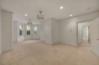 Bedroom 6- has lots of windows, exterior door to backyard and is attached to a large closet /flex space currently being used as workout room