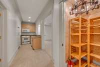 Basement kitchen also has a pantry with shelving