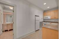 Full bathroom with tile flooring, shower, toilet closet