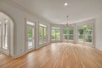 The family room/keeping room is right off the kitchen which is ideal for hosting gatherings, abundant windows over looking backyard oasis, gas fireplace, access to the upper deck which is covered and equipped with a retractable awning