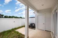 Private backyard with covered patio and large storage closet