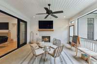 Screened in patio with a gas fireplace.