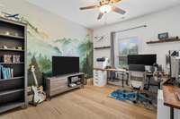 Bedroom 3 on the main floor is currently being used as a home office and has a beautiful hand-painted mural!
