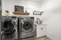 Laundry room is conveniently located on the main floor and has a sink!