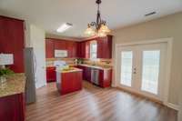 Deluxe kitchen with island and casual dining area. Tons of cabinetry & Walk in Pantry !