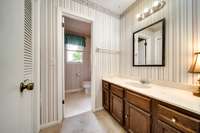 Full bathroom with a huge vanity.