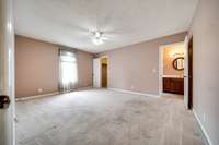 Spacious bedroom with an en suite bathroom and walk in closet.
