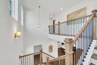 Catwalk hallway to upstairs guest/flex space and extra large walk-in storage area
Previously built home, features and selections may vary