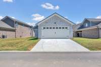 **Listed home has a 3 car garage, third car bay is located behind the patio fireplace
Previously built home, features and selections may vary