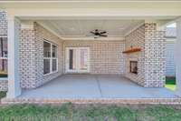 Beautiful, large outdoor side patio with a gas fireplace, gas hookup for your outdoor kitchen and finished ceiling with a fan
Previously built home, features and selections may vary